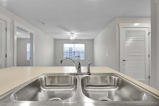 A kitchen with two sinks and a window.