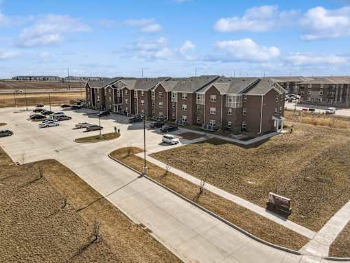 A large apartment complex with multiple buildings and parking lots.