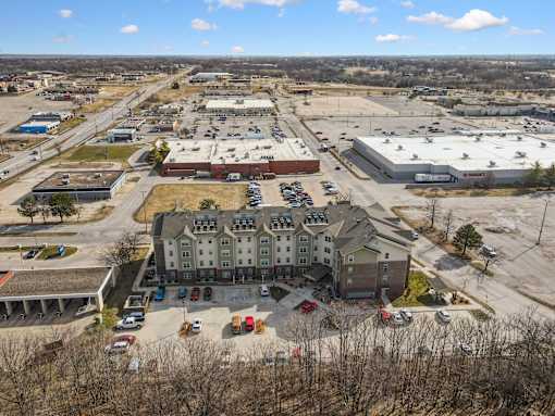 A large building with a parking lot in front of it.