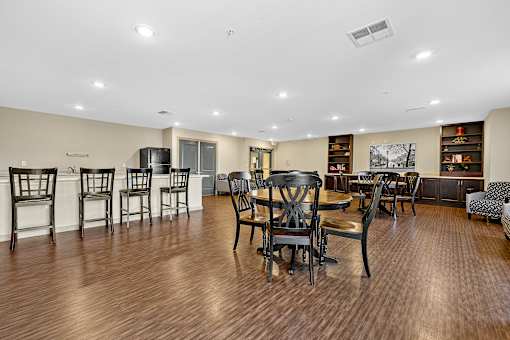 A large room with wooden floors and furniture.