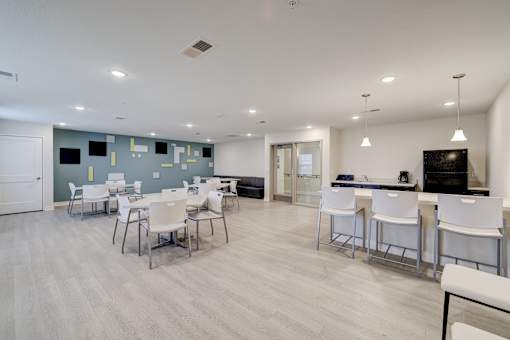 A large open room with a dining table and chairs.