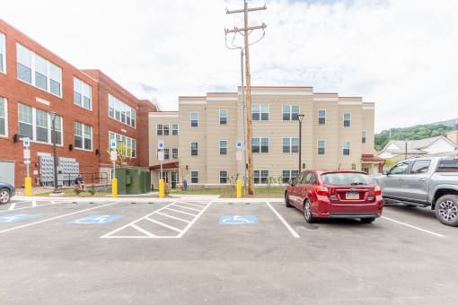 a parking lot in front of an apartment building