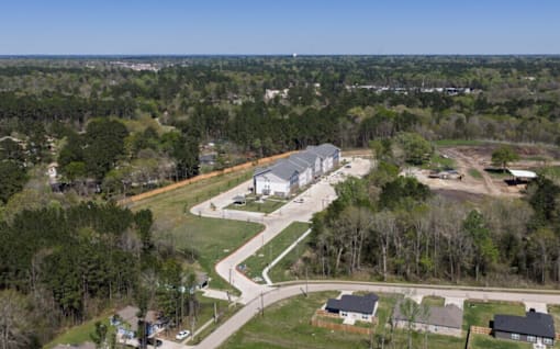 A road is being constructed in a green field.