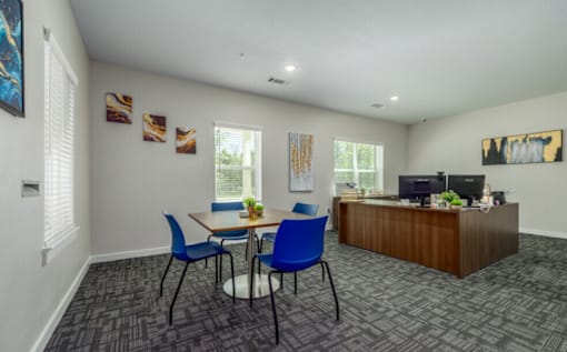 A room with a table and chairs in it.