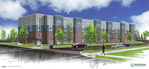 A modern apartment complex with a pedestrian crossing in front.