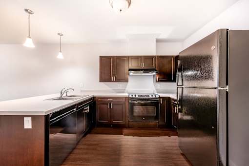 A kitchen with a refrigerator