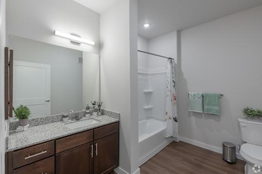 A bathroom with a white toilet and a white sink.