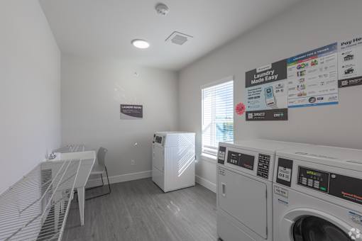 A laundry room with a washer and dryer.