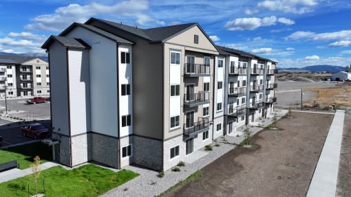 an aerial view of an apartment building on a city street at Yellowstone Landing, Belgrade, MT