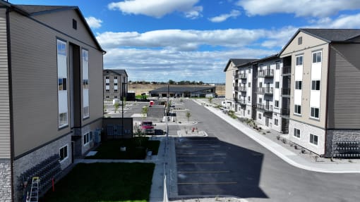 an aerial view of apartment buildings on a city street at Yellowstone Landing, Belgrade, MT, 59714