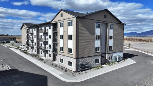 an aerial view of an apartment building on a parking lot at Yellowstone Landing, Belgrade, 59714