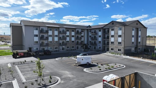 an empty parking lot in front of an apartment building at Yellowstone Landing, Montana, 59714