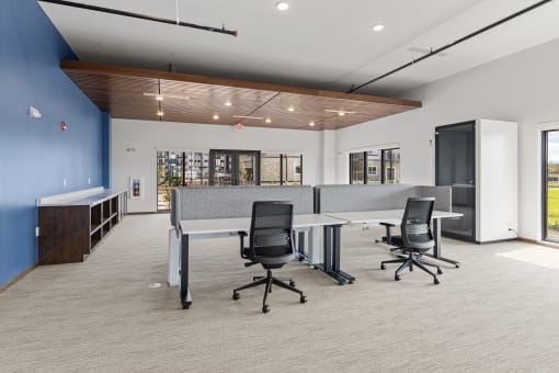 a conference room with a table and chairs in the middle of it at Yellowstone Landing, Belgrade, Montana