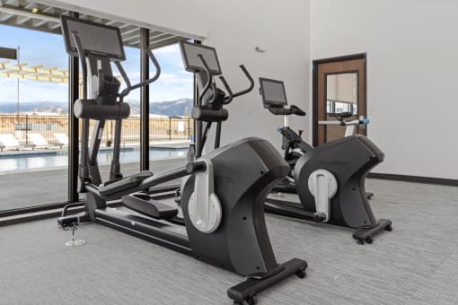 a row of treadmills in a gym next to a pool at Yellowstone Landing, Montana, 59714