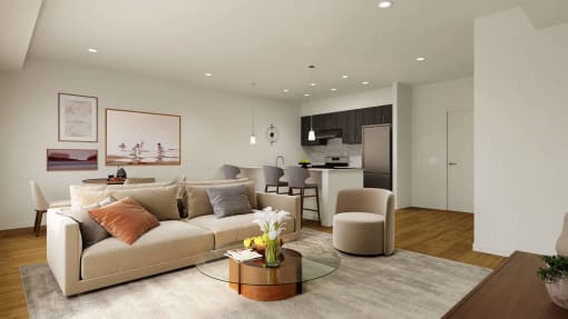 a living room and kitchen with a couch and chairs at Hearthstone Lodge Senior Residences, Auburn, CA 95602