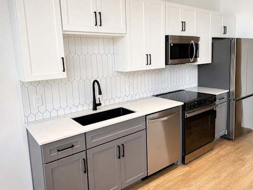 Modern kitchen with stainless steel appliances at Textile Lofts Apartments, Ohio, 45202