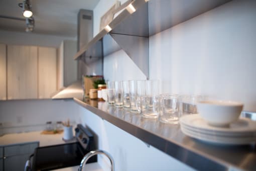 glasses and plates on shelf at 747 Apartments, Indiana