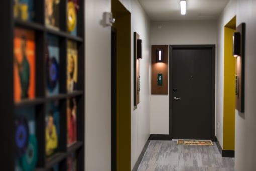 hallway with record albums on wall at Pinnex, Indianapolis, Indiana