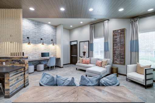 A modern living room with a wooden floor and a large window with curtains.