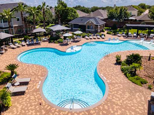 Blue Cool Swimming Pool at Avenues at Shadow Creek Ranch Apartments, Pearland, Texas