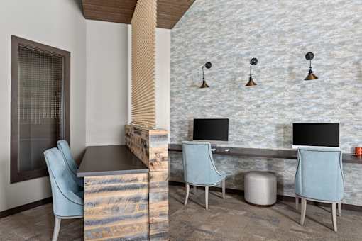 Community business center with computers and chairs at Adara Overland Park, Overland Park, KS, Kansas