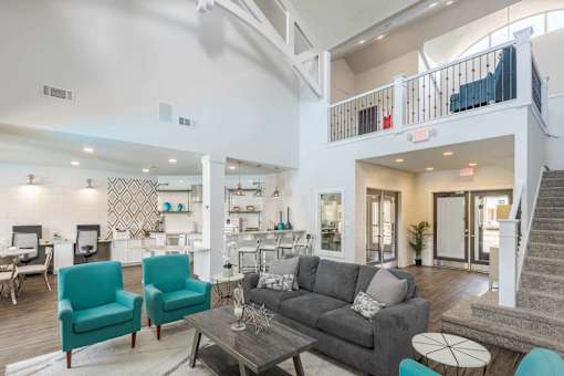 Living Room with Two Blue Chairs at Butternut Ridge Apartments, North Olmsted