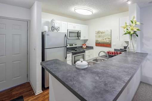 Kitchen with a Granite Countertop at Butternut Ridge Apartments, North Olmsted, Ohio