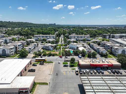 A view of a parking lot with a red truck and a building at CityView, North Kansas City, MO