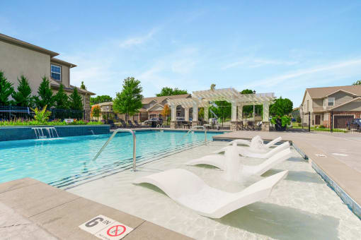 Pool Side Relaxing Area With Sundeck at Prairie Pines Townhomes, Kansas