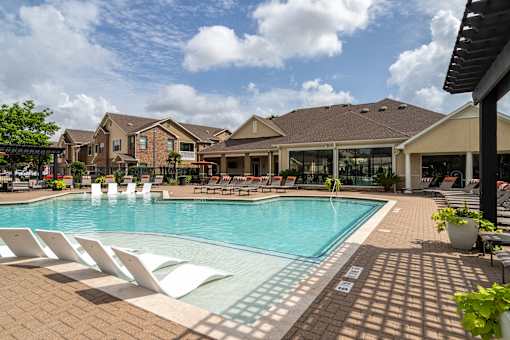 Swimming pool with lounge chair at Grand Villas at Cinco Ranch, Katy, 77494