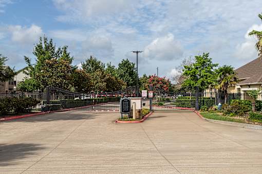 Sunny day at the entrance of a gated community at Grand Villas at Cinco Ranch, Texas