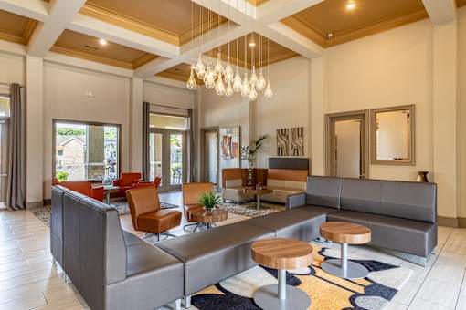 Common room with large couch at Grand Villas at Cinco Ranch, Katy