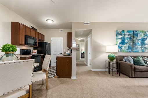 view of kitchen and living room from front door of apartment at The Greyson, Ohio