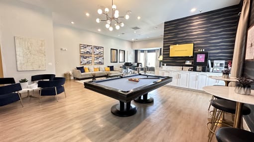 a game room with a pool table in the center of it at Waterstone at Cinco Ranch, Katy, TX, 77450