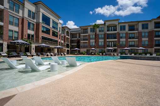 Lounge chairs by the pool at Imperial Lofts, Sugar Land, 77498