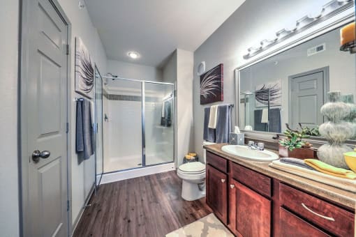 a bathroom with a shower toilet and sink at Waterstone at Cinco Ranch, Katy, 77450