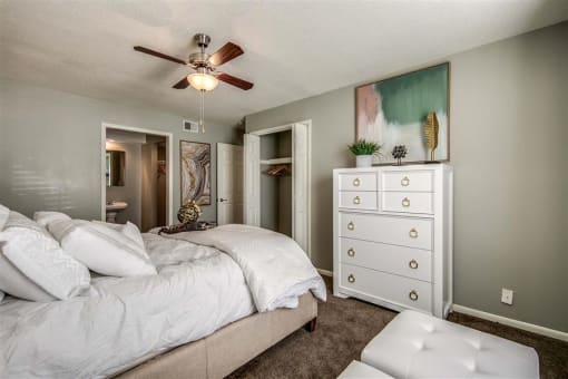 bedroom with grey carpet and natural light at London House Apartments, Lenexa, Kansas