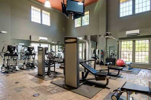 Fitness center with strength training equipment at London House Apartments, Lenexa, Kansas