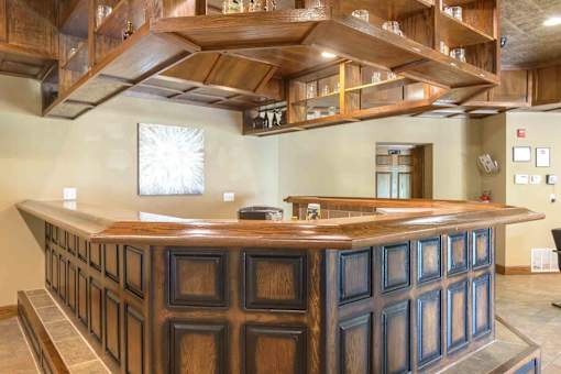 Clubhouse reception desk with custom woodwork at London House Apartments, Lenexa, KS 66215