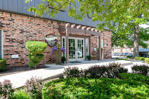 Leasing office entrance with covered pergola at London House Apartments, Lenexa, Kansas