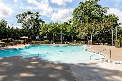 Swimming swimming pool with volleyball net at London House Apartments, Lenexa