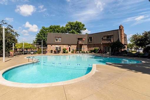 Outdoor swimming pool with spa and clubhouse at London House Apartments, Kansas, 66215