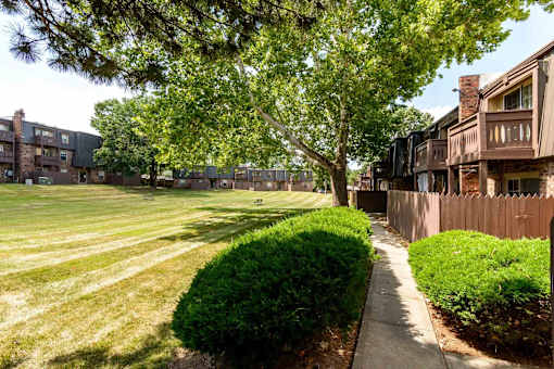 Courtyard with mature trees and walking paths at London House Apartments, Lenexa, 66215