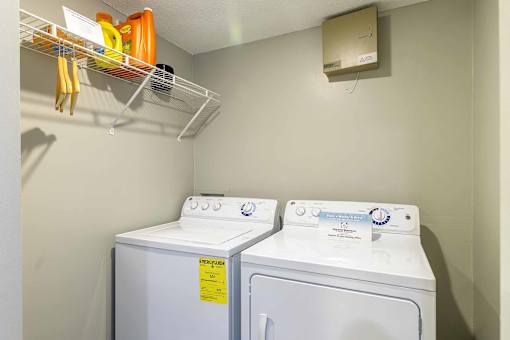 In unit laundry room with washer and dryer at London House Apartments, Kansas