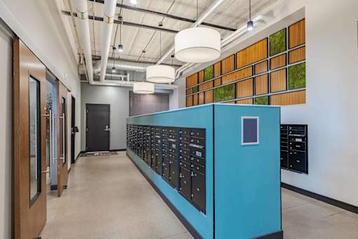 A long hallway with a blue panel on the wall.