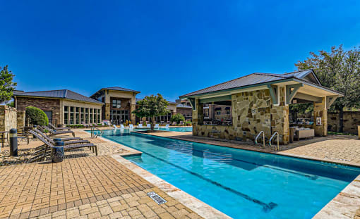 a swimming pool with a pavilion next to a resort style pool at Discovery at Craig Ranch, McKinney, TX