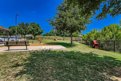 a park with a bench and a tree at Discovery at Craig Ranch, McKinney, 75070