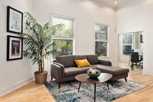 a living room with a couch and a coffee table at Sovereign at Overland Park, Overland Park