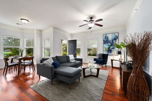 a living room with a couch and a ceiling fan at Sovereign at Overland Park, Kansas, 66213