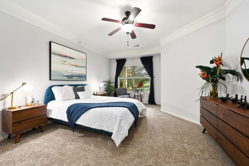 a bedroom with a bed and a ceiling fan at Sovereign at Overland Park, Overland Park, 66213